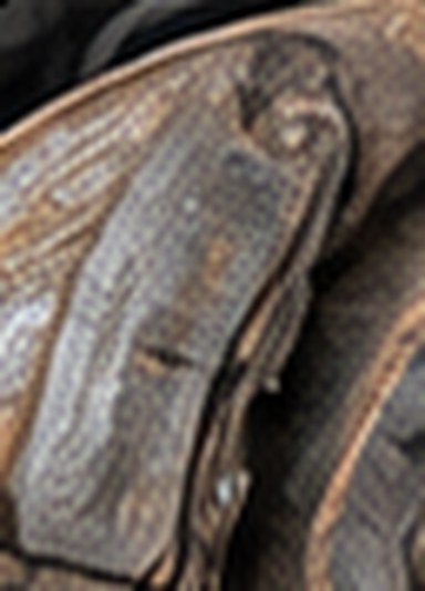 Close-up of a worn brake pad from the Altima