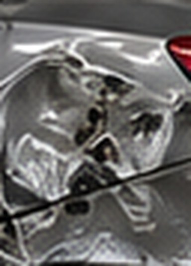 Close-up of the creased metal on the Accord's rear quarter panel