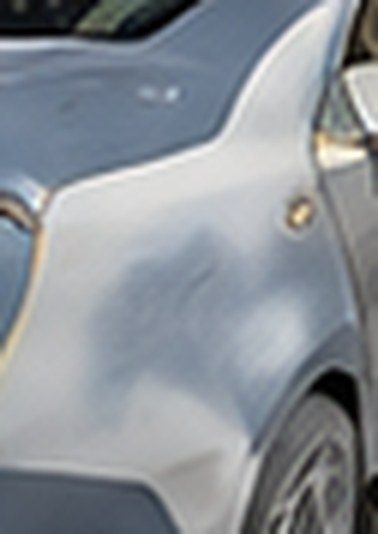 Body filler shaped and sanded on the Accord's quarter panel