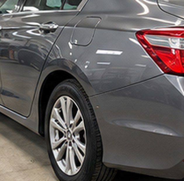 Gray Honda Accord rear door and quarter panel after repair, smooth and glossy