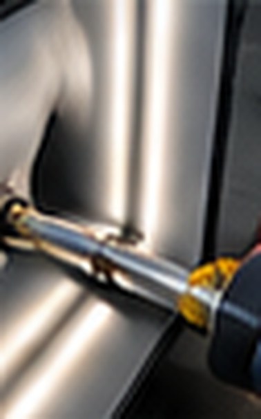 Dent repair tool working on the BMW door