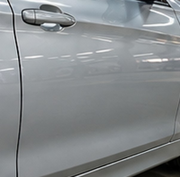 Silver BMW 3 Series door after the dent repair, smooth and even