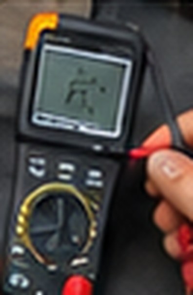 Multimeter testing the Equinox's circuits